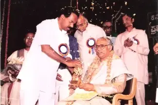 Pandit ji receiving Sangeeta Nritya Academy award from Shri Veerappa Moili